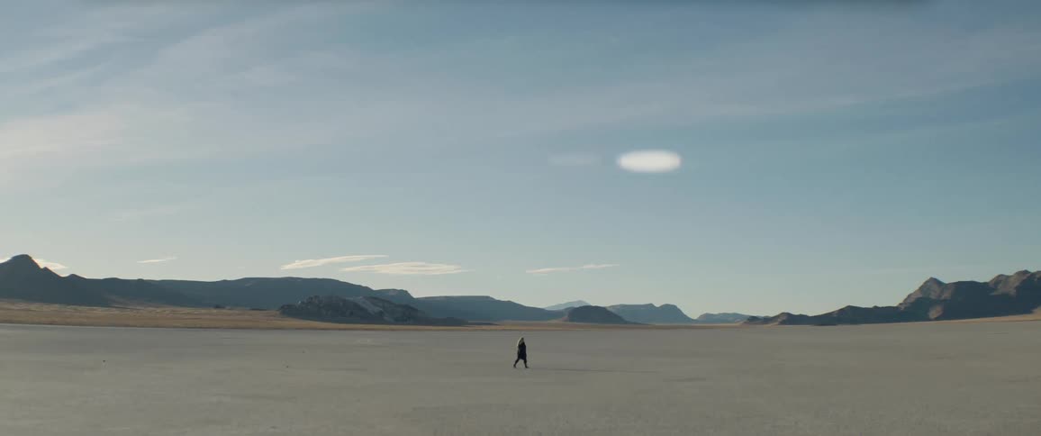 A person walks in the desert