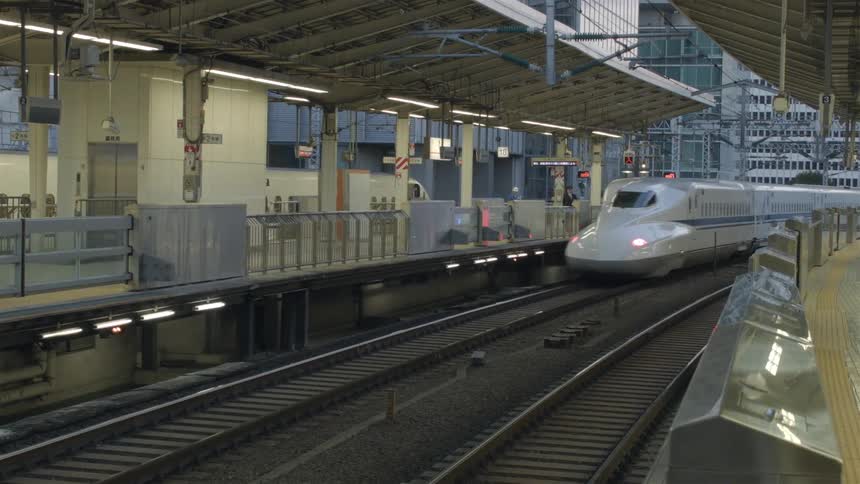 A train travels past the station