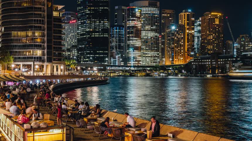Time lapse view of people by the pier outdoors at night