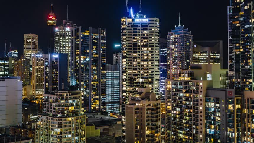 Lights on tall buildings and skyscrapers light up a big city at night