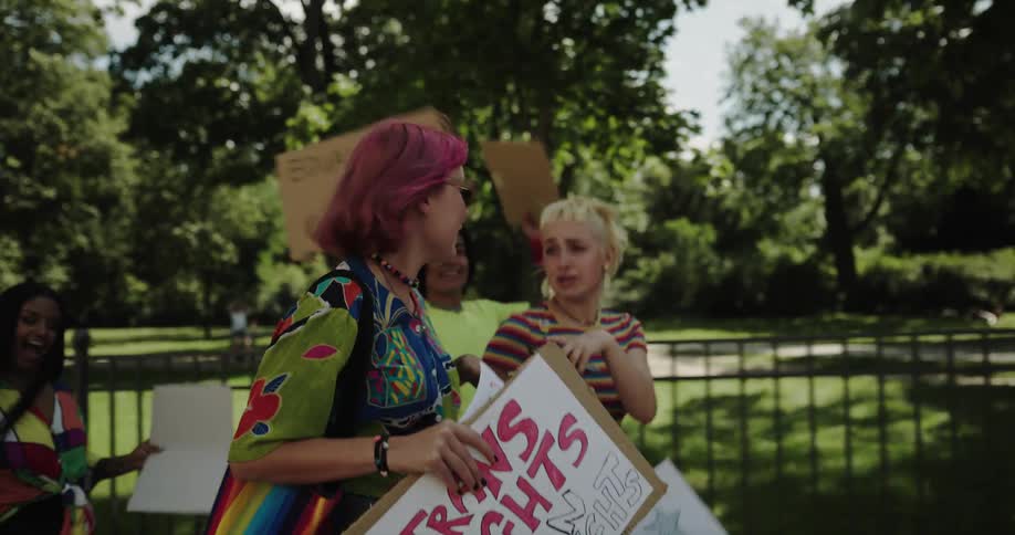 A group of women are walking and protesting outdoors in spring