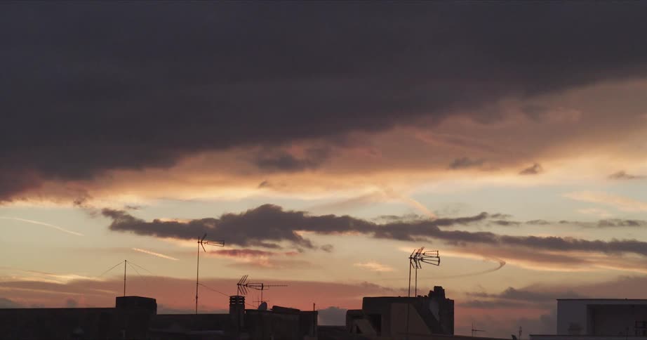 A cloudy evening sky above a building