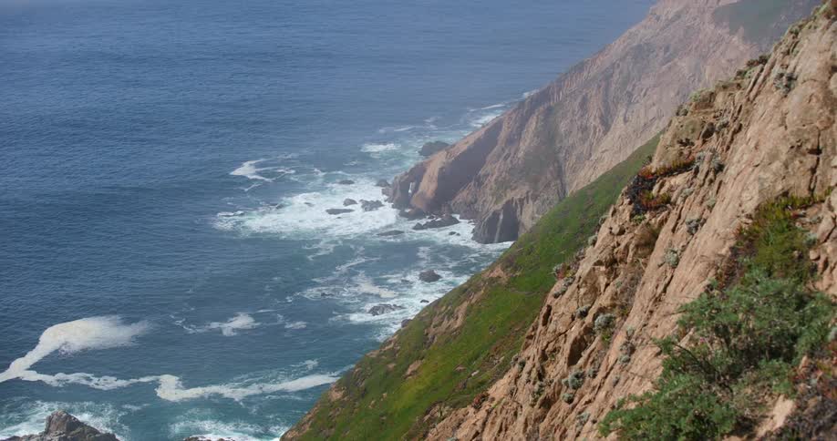 Aerial view of mountains are displayed by the ocean