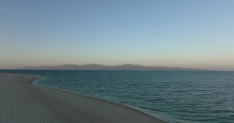 Ocean waves are moving towards the beach coast
