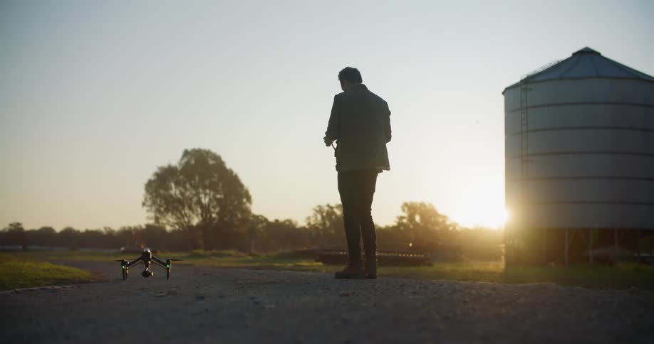 A man flying a drone outdoors