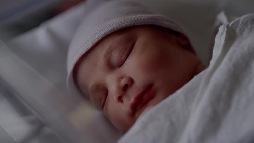 A newborn baby sleeps