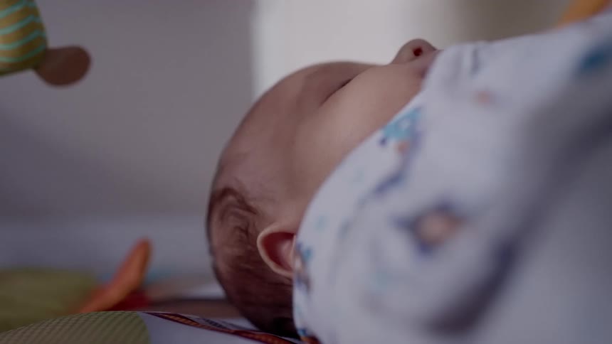 Sleeping baby covered with a baby blanket