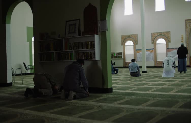 Muslim men pray at mosque