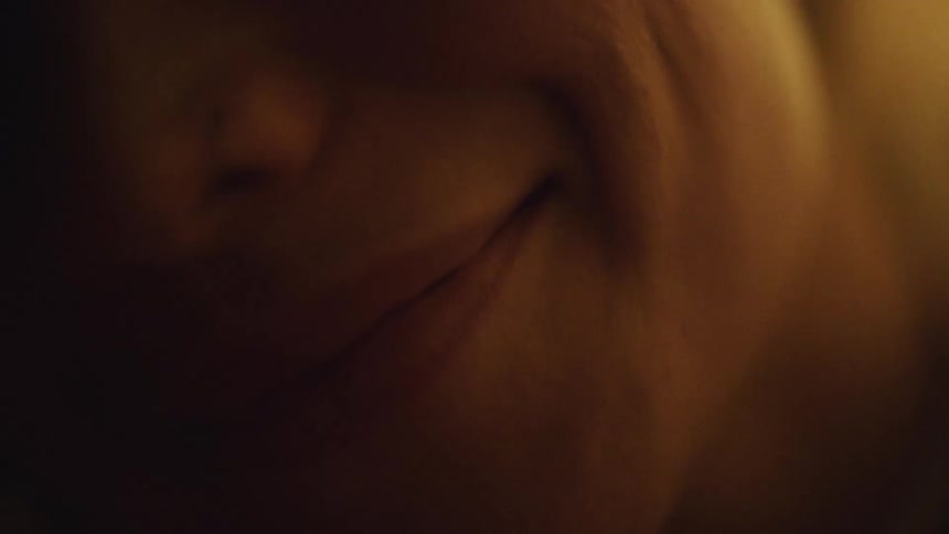 Woman in shadow smiles