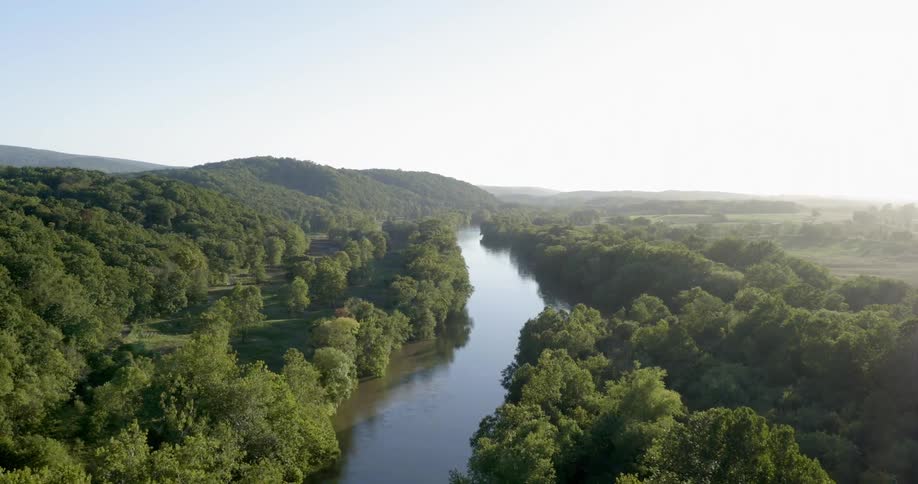 A river runs through thick woods