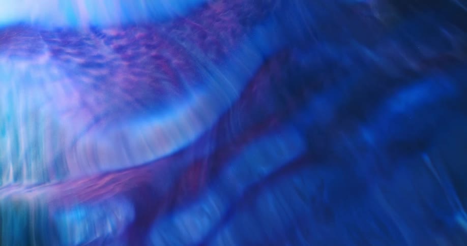 Multi hued fluid spreads forming striations and layers