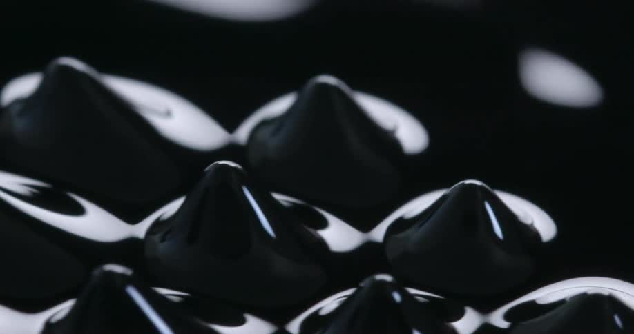 Liquid is being formed into triangle shapes