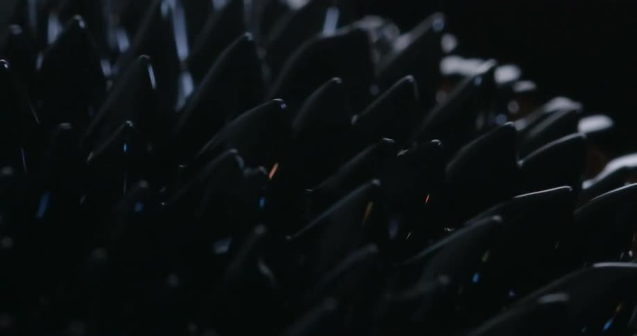 Mass with uneven surface and nodules that change size and shape moves across area