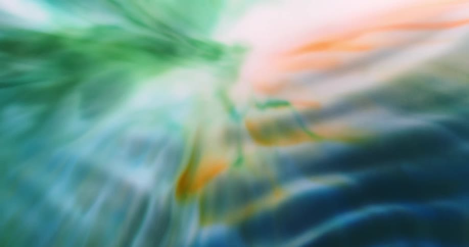 Rippling blue orange and green paint