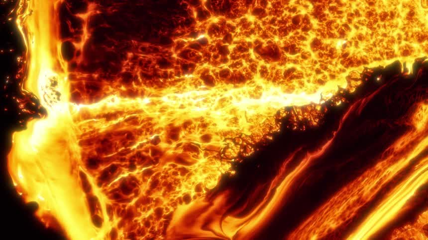 An ocean of bright orange and yellow molten lava flowing and burning