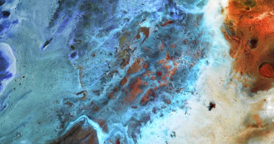 Blue and orange colorful bright liquid ink flowing over a surface