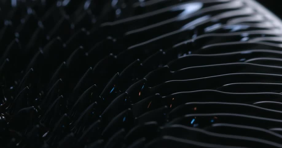 Textured rippling black liquid