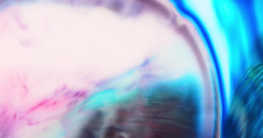 Rippling and flowing pink and blue paint