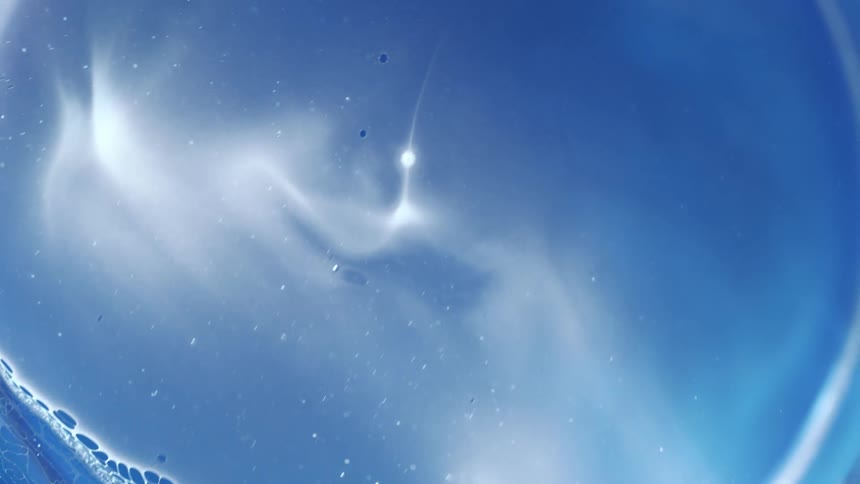 Flowing bubbling blue liquid