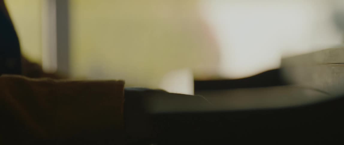 A person playing a piano indoors