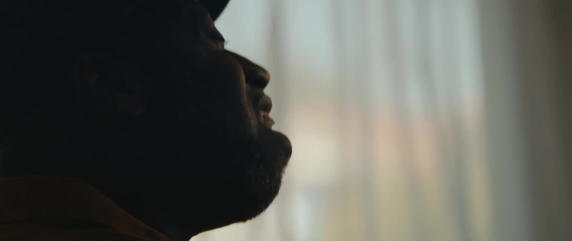 A man is singing by the window