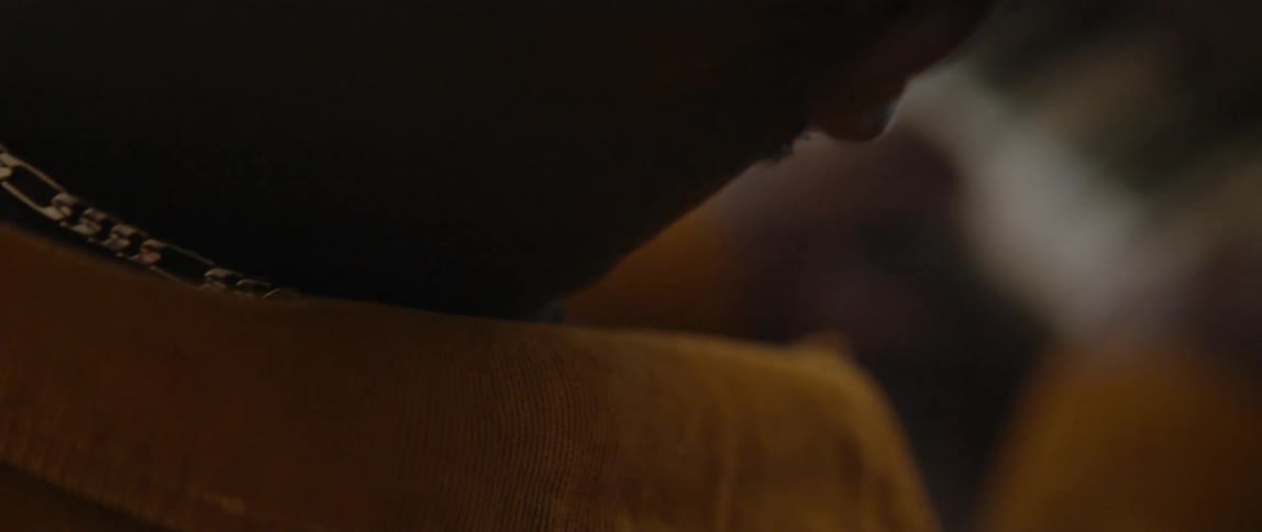 Close up of the back of the head of a musician playing piano