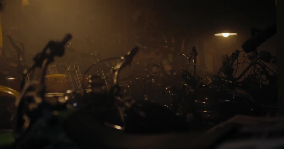 Dimly lit facility holds several motorcycles
