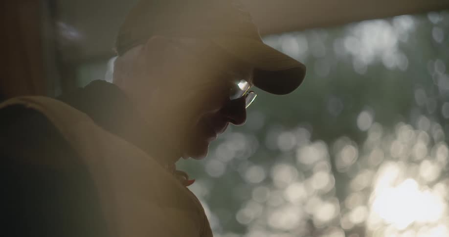 A man is looking at something outside