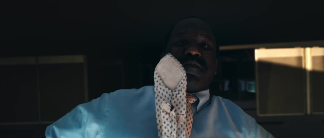 A man with a tie suspended in air