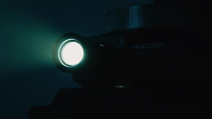 Light being emitted from a projector in a dark room