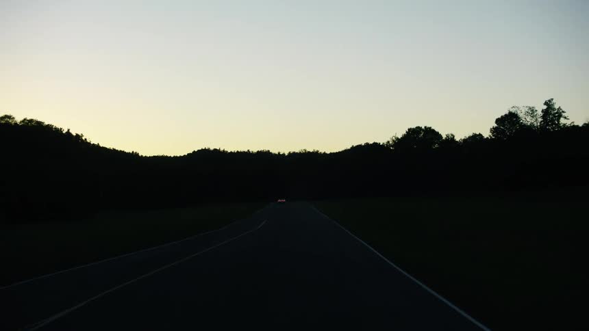 A car speeds down the road