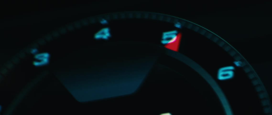 The dashboard of a speeding car