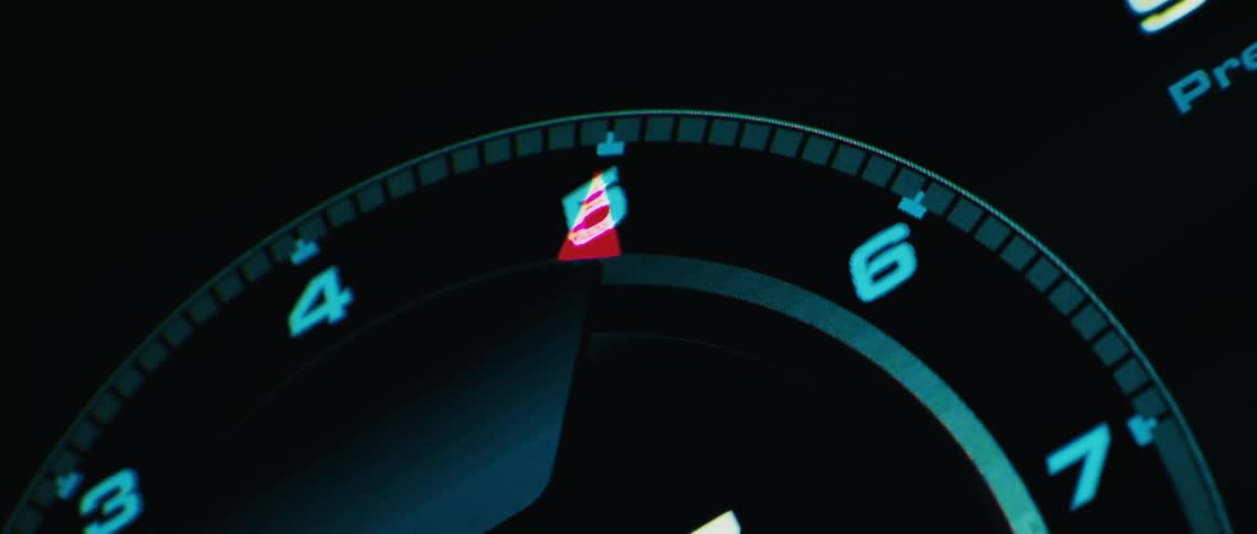 A gauge flashes and moves lighting up the numbers