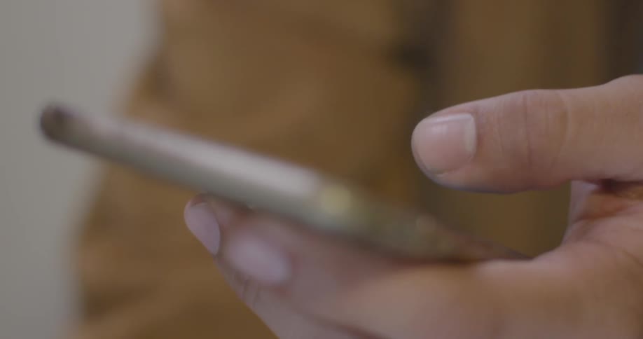 A person scrolls through a phone