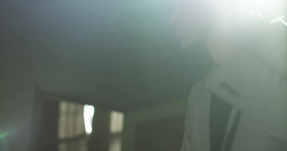 A man puts on a jacket