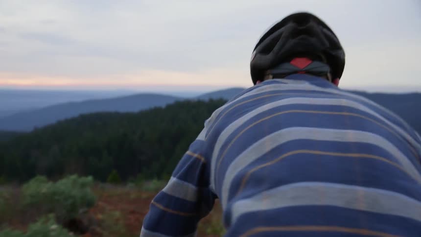 A man riding a mountain bike in the mountains