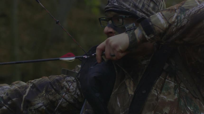 A man pulls back the arrow in a bow