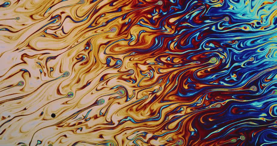 Chaotic psychedelic multicolored bright liquid ink swirling