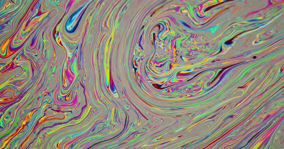 Chaotic psychedelic multicolored bright liquid ink swirling