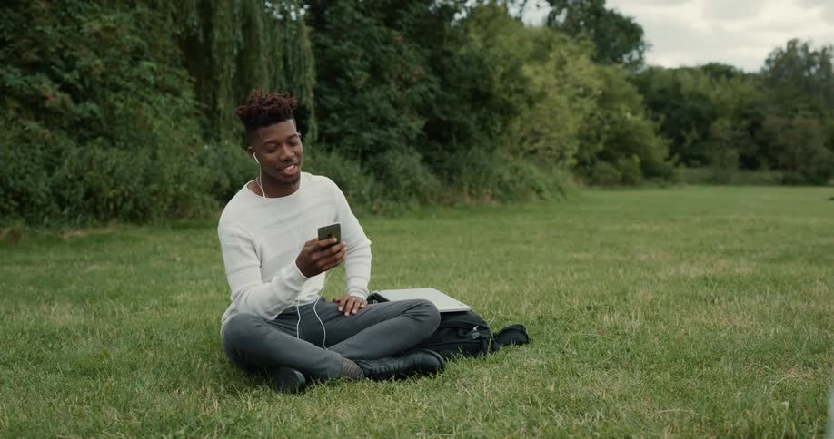 A man using a smartphone outdoors