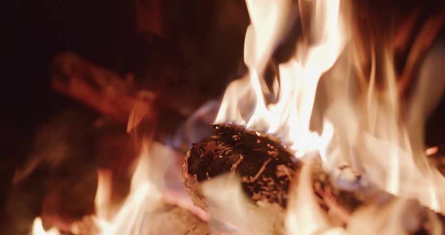 A bonfire is burning during the night time