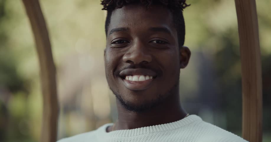 A man looks up and smiles