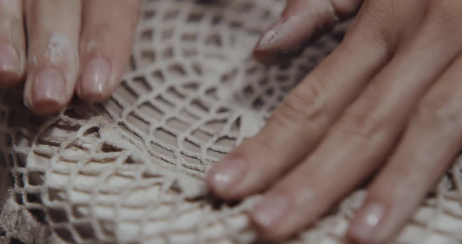 Close up view of a person making crafts is displayed