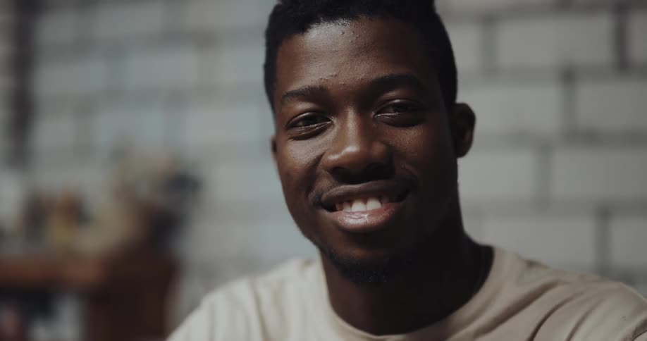 A man talks and smiles