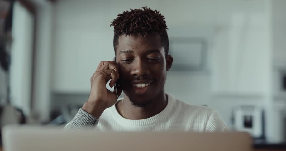 A man answers his cell phone