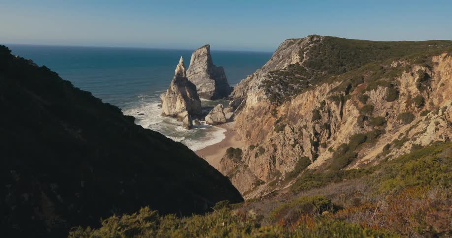 Aerial view of mountains near the coast is displayed