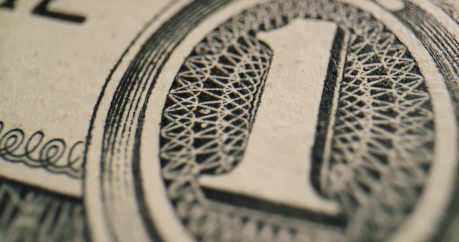 Close up view of a dollar bill is displayed