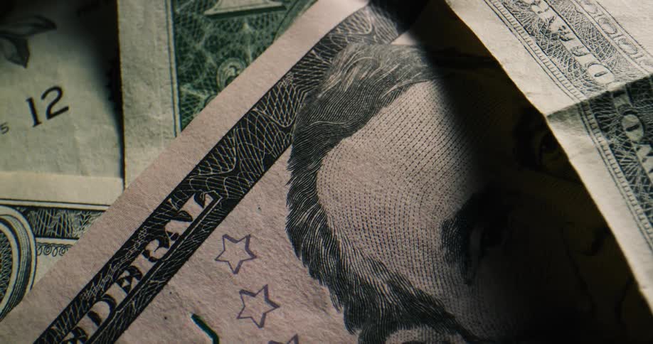 Close up of united states dollar bills of various denominations