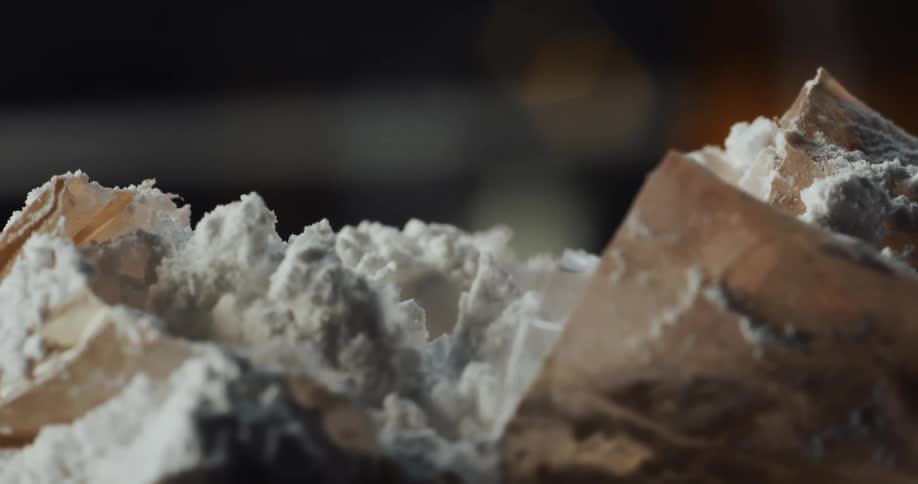 Flour inside of a ripped paper bag