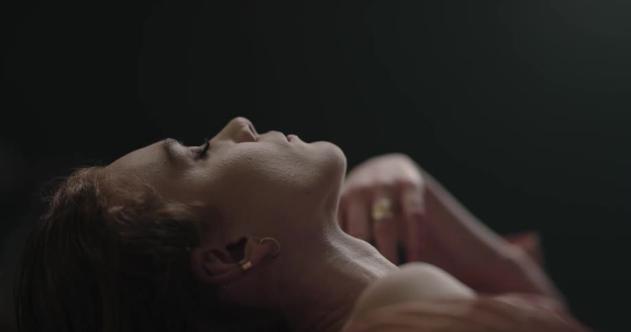 A woman is laying back and resting